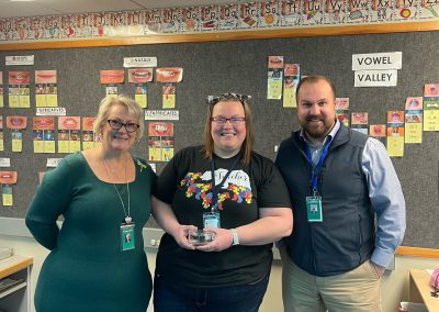Impact Maker for April Amanda Knutzen with Damon Hargraves and Superintendent Dr. Mika