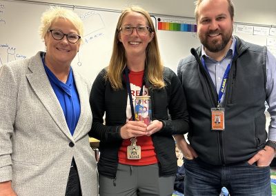 Superintendent Dr. Mika, Emily Milligan, and Principal Hargraves.